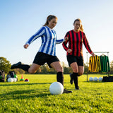 Women's football kit with long-sleeved striped shirt, shorts, and knee-high socks - product detail