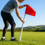 Corner flag poles with ground sleeves for sports pitches