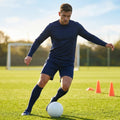 Men's football kit in various colours, including long-sleeve shirt, shorts, and socks