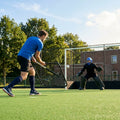 Handheld hockey rebounder with galvanised steel frame and black netting - product detail