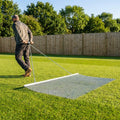 Steel drag mat on a sports field, showcasing its robust design for field maintenance