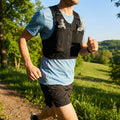 Running hydration vest with adjustable straps and storage pockets
