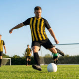 Men's striped football kit with shirt, shorts, and socks