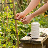 Synthetic twine roll in black, white, and blue for DIY and craft use