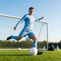 Men's football kit in various colours, including long-sleeve shirt, shorts, and socks