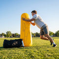 High-visibility American football training dummies in yellow PVC