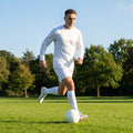 Men's football kit in various colours, including long-sleeve shirt, shorts, and socks