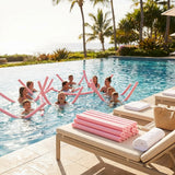 Colourful swimming pool noodles made from EVA foam