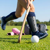 Hockey shin pads with polypropylene shell and EVA foam lining for field protection