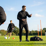 Windbreaker jacket in black and navy, ideal for training and casual use