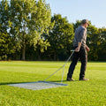 Steel drag mat on a sports field, showcasing its robust design for field maintenance