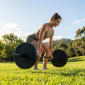 Black Olympic bumper plates made from Virgin rubber