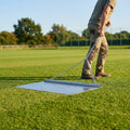 Steel drag mat on a sports field, showcasing its robust design for field maintenance