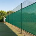 Green Tennis Court Windbreaks on an outdoor tennis court