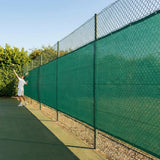 Green Tennis Court Windbreaks on an outdoor tennis court