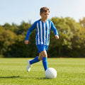Kids' football kit with striped long sleeve shirt, shorts, and knee-high socks