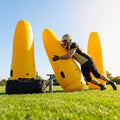 High-visibility American football training dummies in yellow PVC