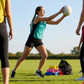 Vibrant netball bibs made of polyester mesh for schools and clubs