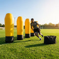 High-visibility American football training dummies in yellow PVC