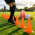 Set of vibrant football training cones in various sizes and colours