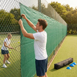 Green Tennis Court Windbreaks on an outdoor tennis court