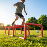 Adjustable foam hurdles in red, yellow, green, and blue for young athletes