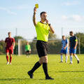 Football referee kit with fluro yellow or black shirt, shorts, and socks
