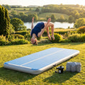 Inflatable gymnastics mat in orange and grey designed for home and gym use