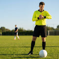 Football referee kit with fluro yellow or black shirt, shorts, and socks