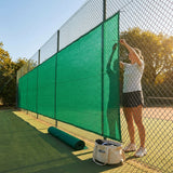 Green Tennis Court Windbreaks on an outdoor tennis court