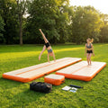 Inflatable gymnastics mat set including mat, beam, and block in use