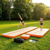 Inflatable gymnastics mat set including mat, beam, and block in use