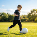Kids' tracksuit bottoms in black and navy, ideal for youth sportswear