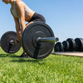 Black Olympic bumper plates made from Virgin rubber