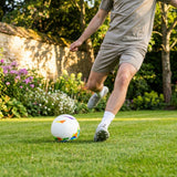 Lightweight garden football with traditional white design and colourful patterns